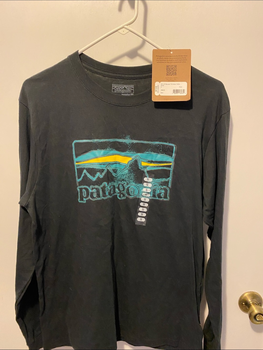 Patagonia Black Long Sleeve Tee with Teal & Yellow Graphic Logo